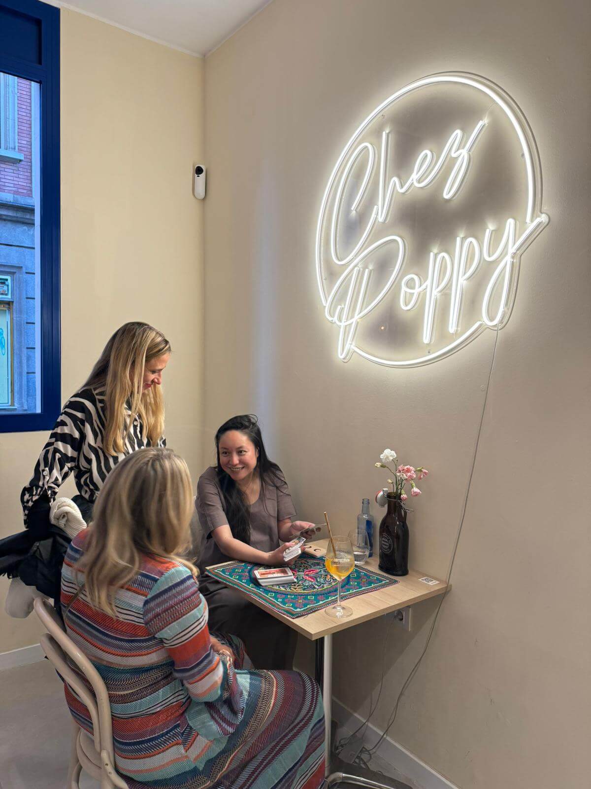 Group of friends sharing a festive Tarot experience for a bachelorette party in Barcelona